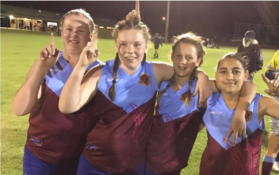 Girls from the club celebrating at night training