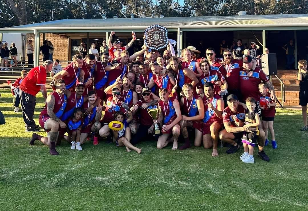 League premiers 2024 in front of the clubrooms holding the shield